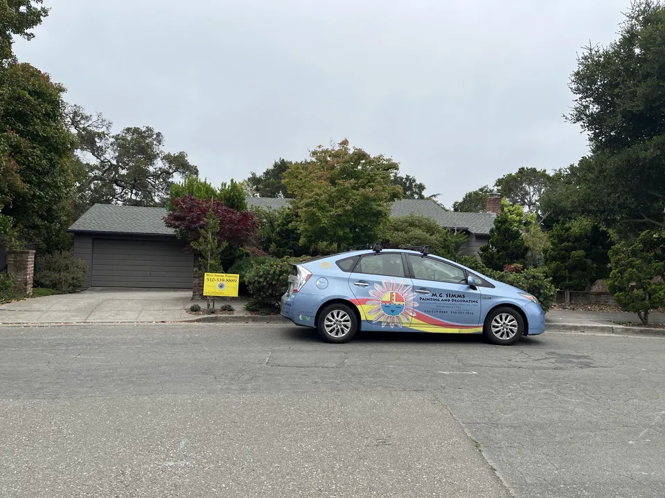 The M.G. Simms Painting work truck parked on a Bay Area street.