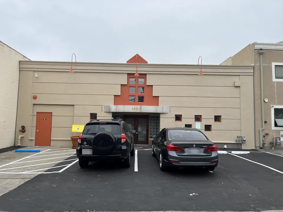 Commercial property exterior photographed from the parking lot after painting.